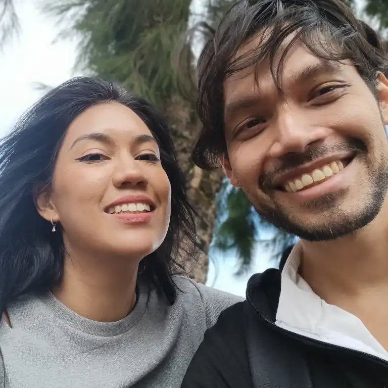 Close-up portrait of Henry and Yayi, the real people behind CCS Vintage. As founders, they personally handle the design and production logistics of your custom vinyl record.