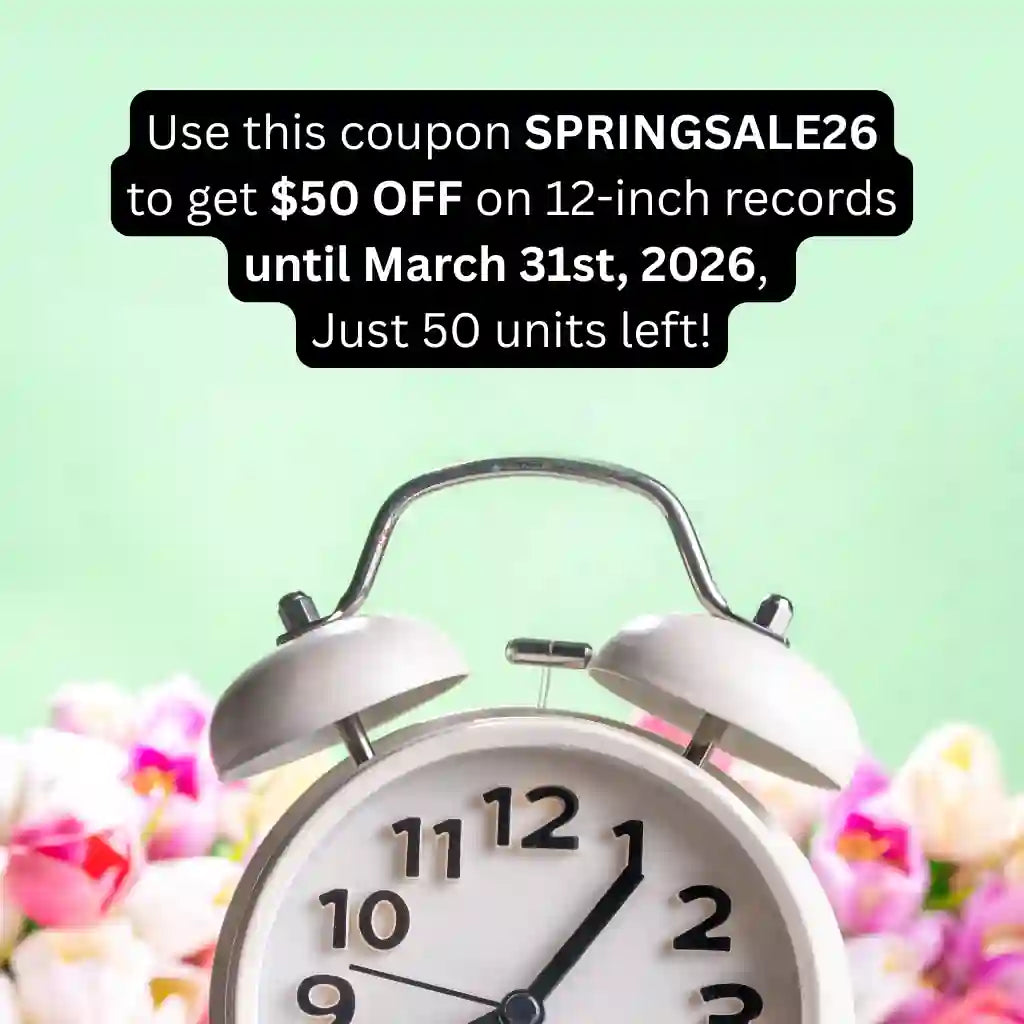 A white vintage alarm clock in focus against blurred pink tulips. An overlaid message in a black speech bubble promotes a Spring Sale: Use coupon code SPRINGSALE26 for $50 off 12-inch vinyl records, valid until March 31st, 2026, with only 50 units remaining.