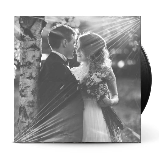 Professional high-resolution glossy vinyl jacket printed with a romantic black and white wedding photograph.