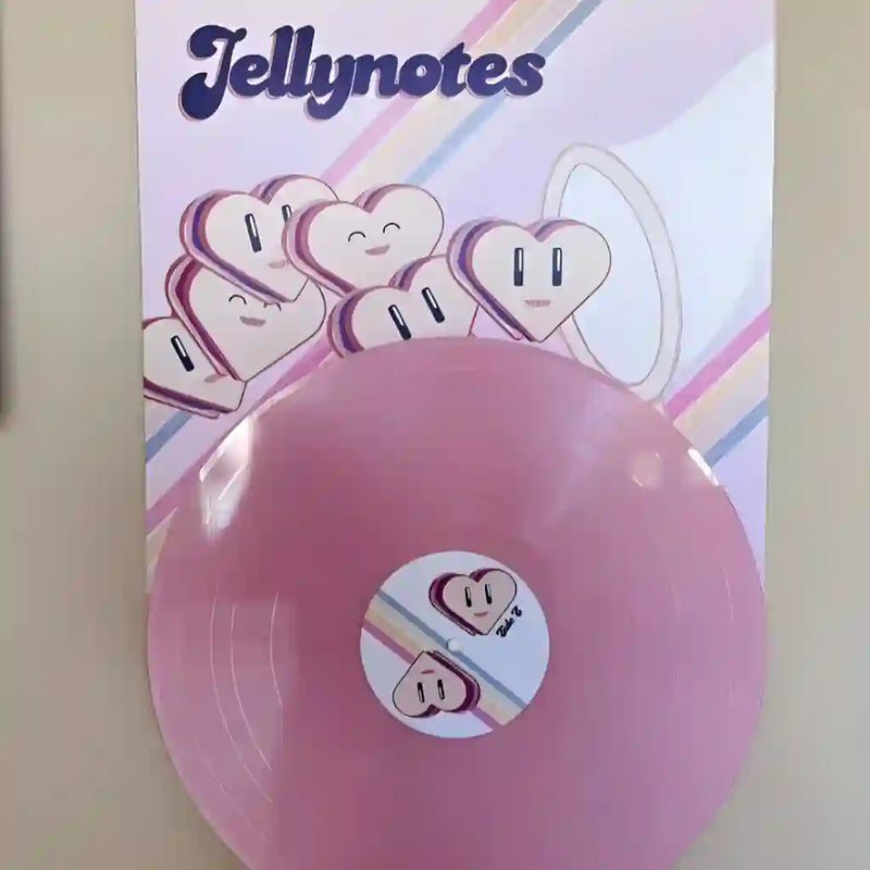 A light pink personalized vinyl record with a custom illustrated cover, showing how our service handles unique designs for personal mixtapes.