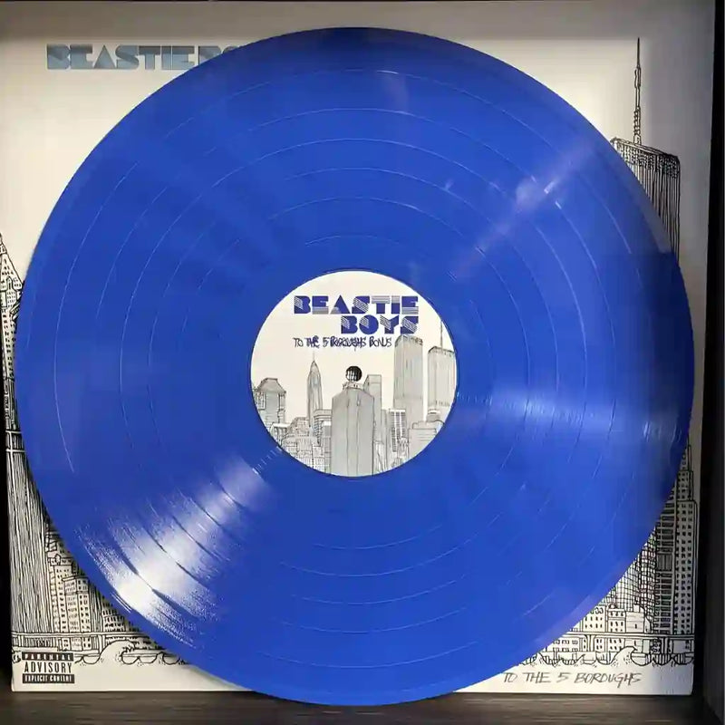 A solid royal blue custom vinyl record with a bespoke themed label, displayed against a high-quality illustrated black and white jacket.